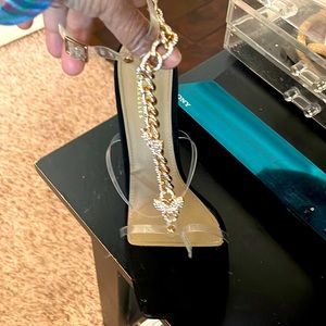 Black heel with butterflies on them that wrap around the ankle. Never worn 7.5